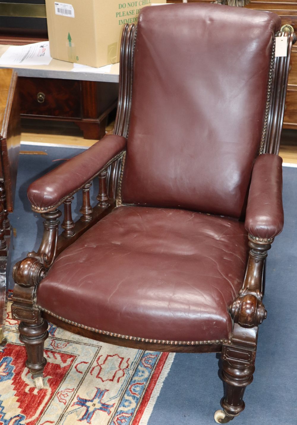 A burgundy leather upholstered Victorian mahogany library chair, W.70cm, D.84cm, H.94cm